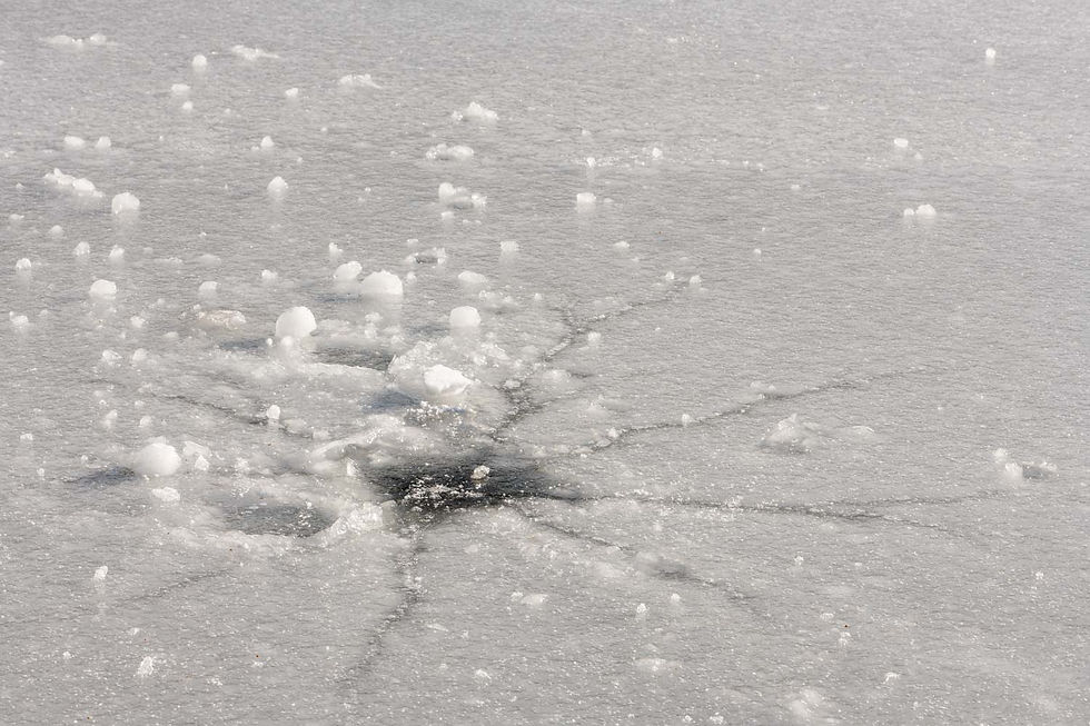 nature photography crack in ice over pond