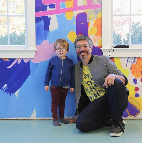 photo of artist avaf with a young boy