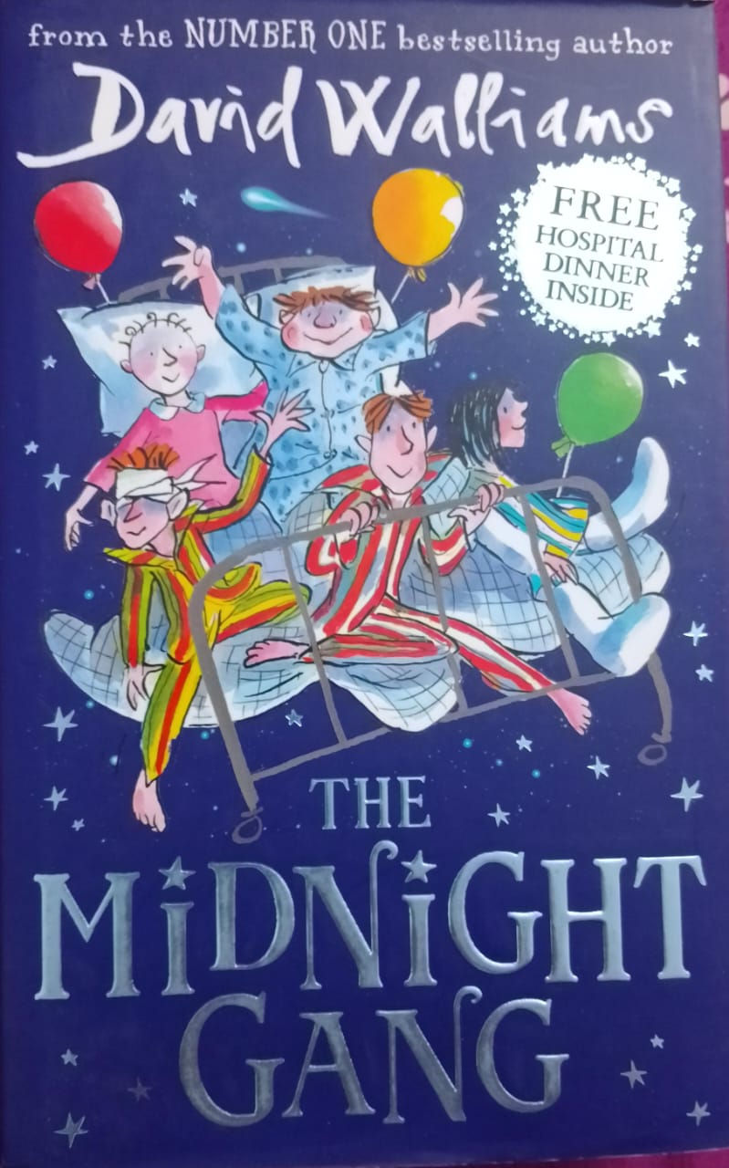 Children in pajamas on a bed, "The Midnight" book cover