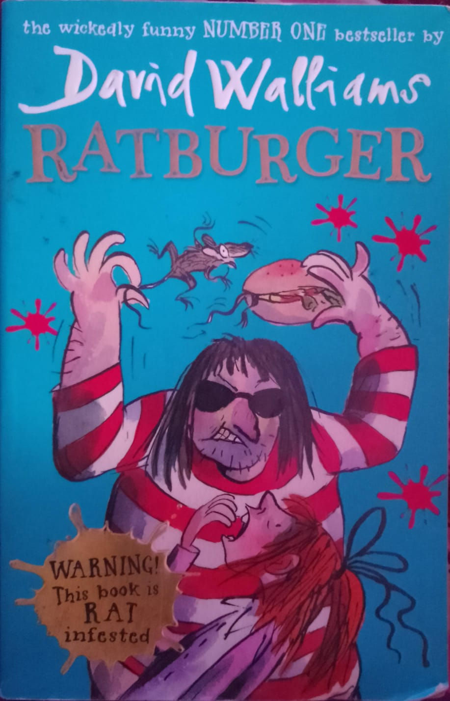 Ratburger book cover: man with sunglasses fighting a rat over a burger