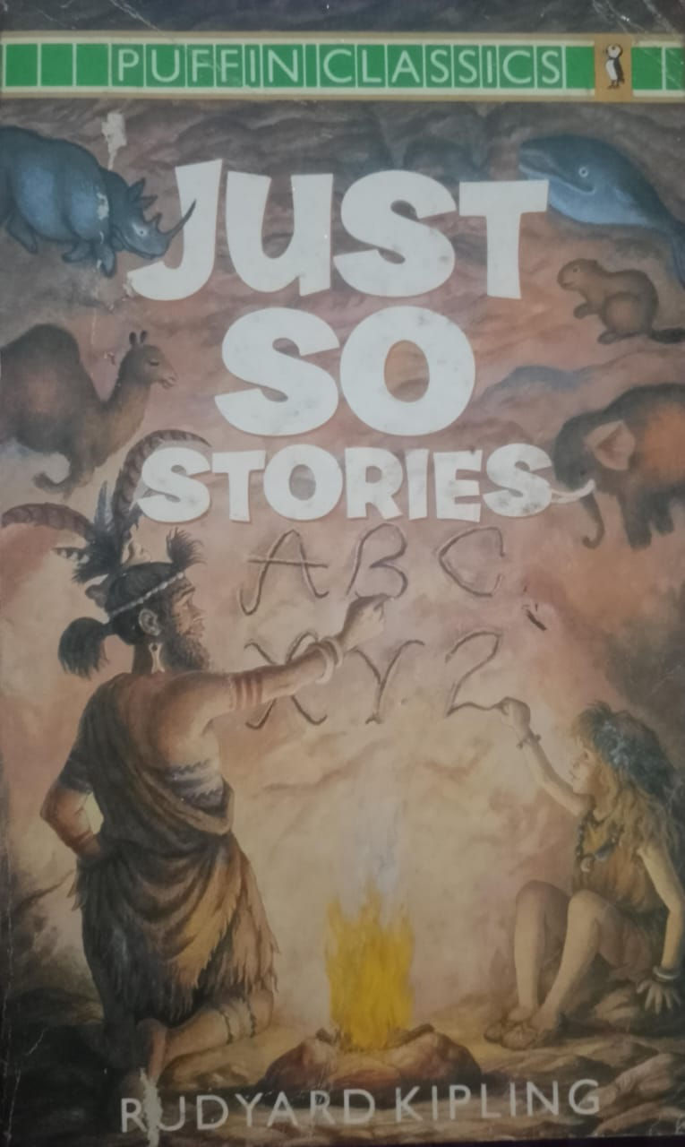 Just So Stories book cover, caveman writing ABC's, drawings of animals.