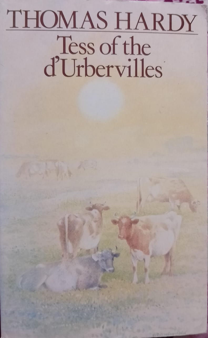 Cows in a field with visible text Tess of the d'Urbervilles background.