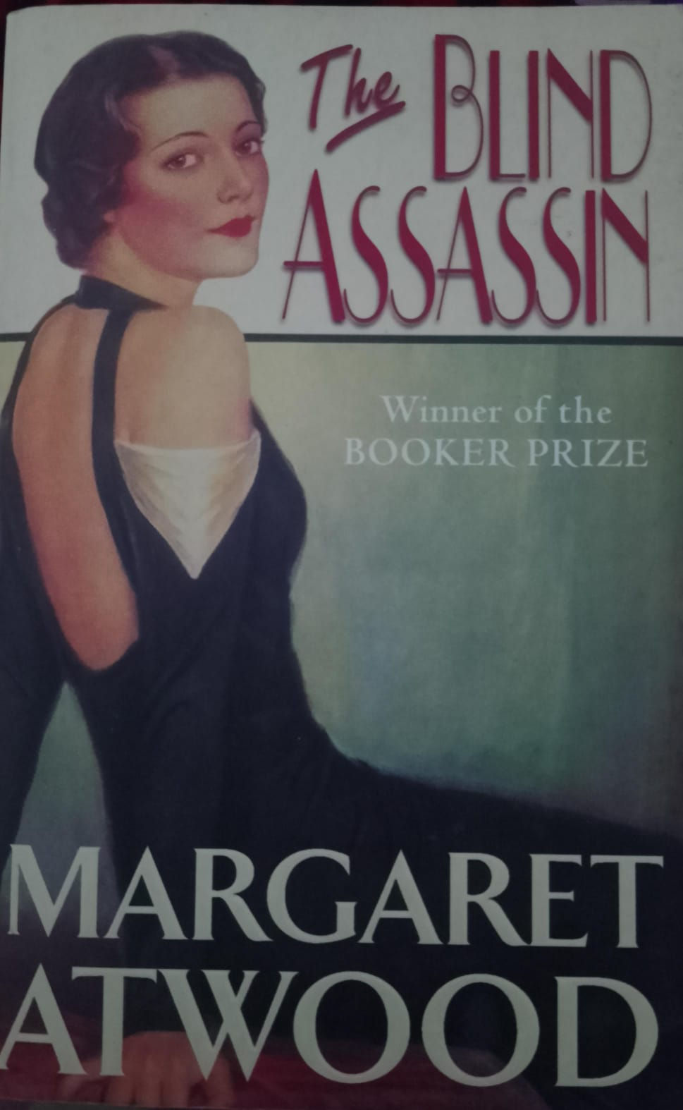 Woman in black dress on book cover, ASSASSIN, Booker Prize, Margaret.