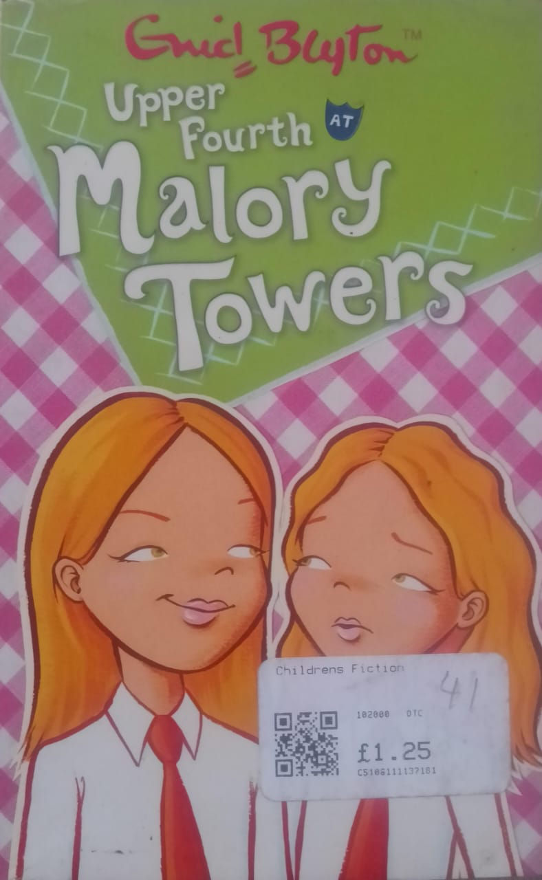 Malory Towers book cover, two girls with red hair and text.
