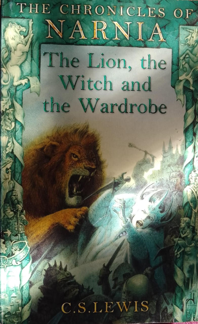 The Lion, the Witch and the Wardrobe book cover depicting a lion roaring.