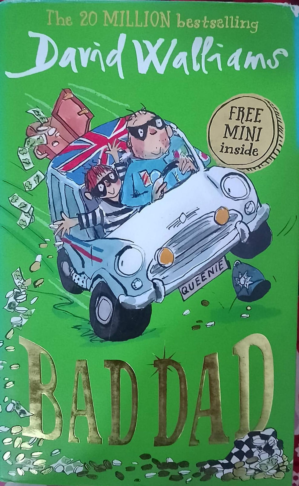 Book cover: robbers in a car, "DAD" title, free mini inside