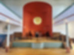 chapel area of old Methodist Church reimagined and renovated to a community performance space with large stage