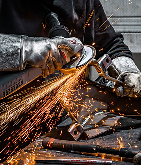 view-worker-grinding-piece-metal.jpg