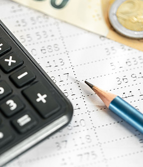 calculator-money-pencil-closeup-blurred-background.jpg