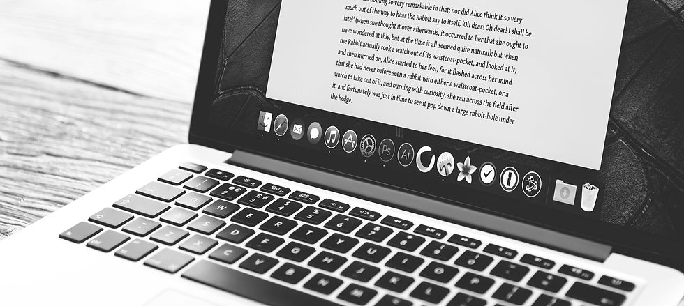 A black and white image of a laptop screen filled with text.