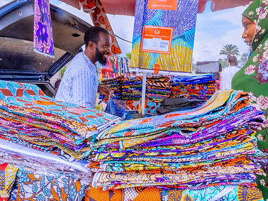 man_selling_fabric_echoes_of_bauchi