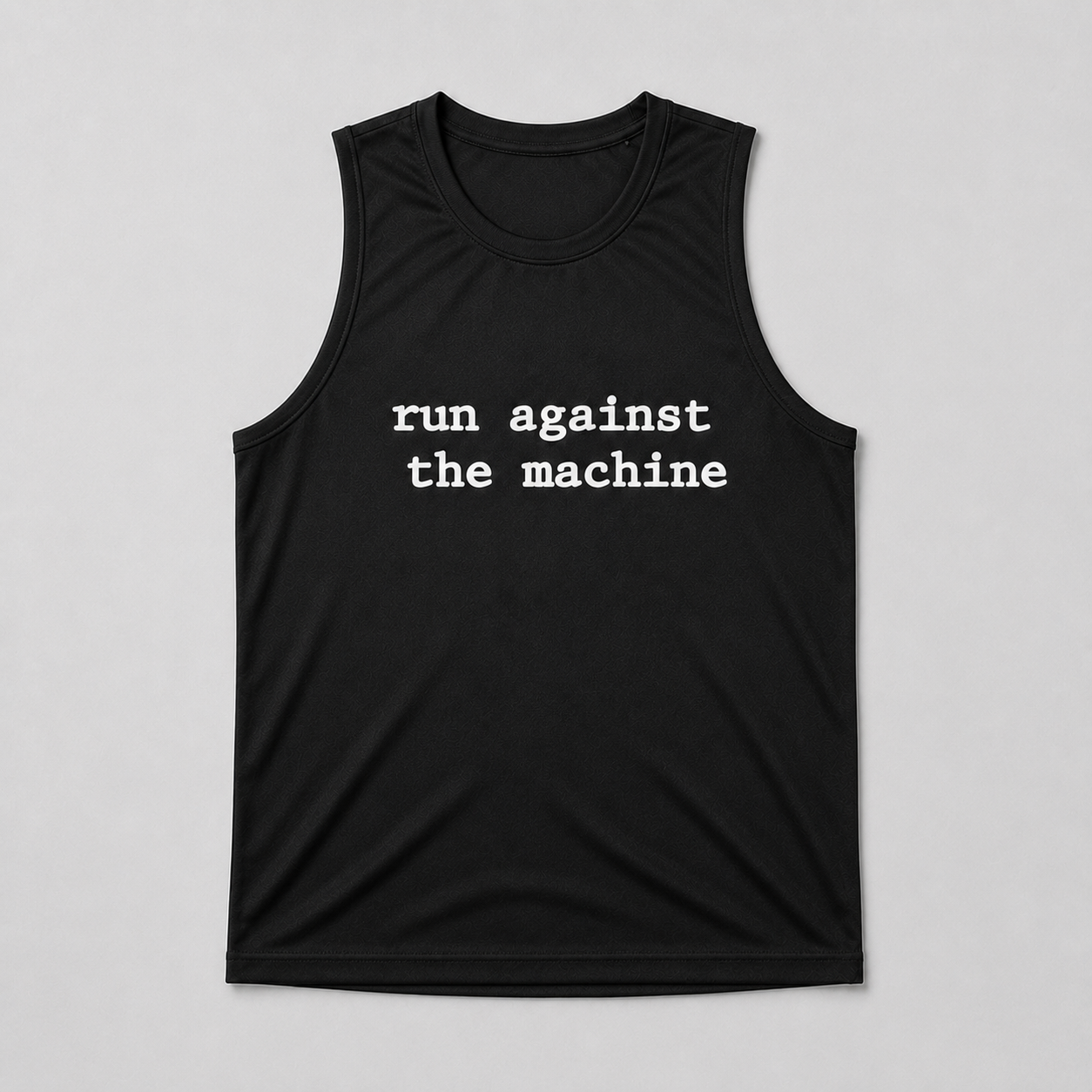 Black Run Against the Machine performance running vest shown in a flat lay, with white typewriter-style text across the chest
