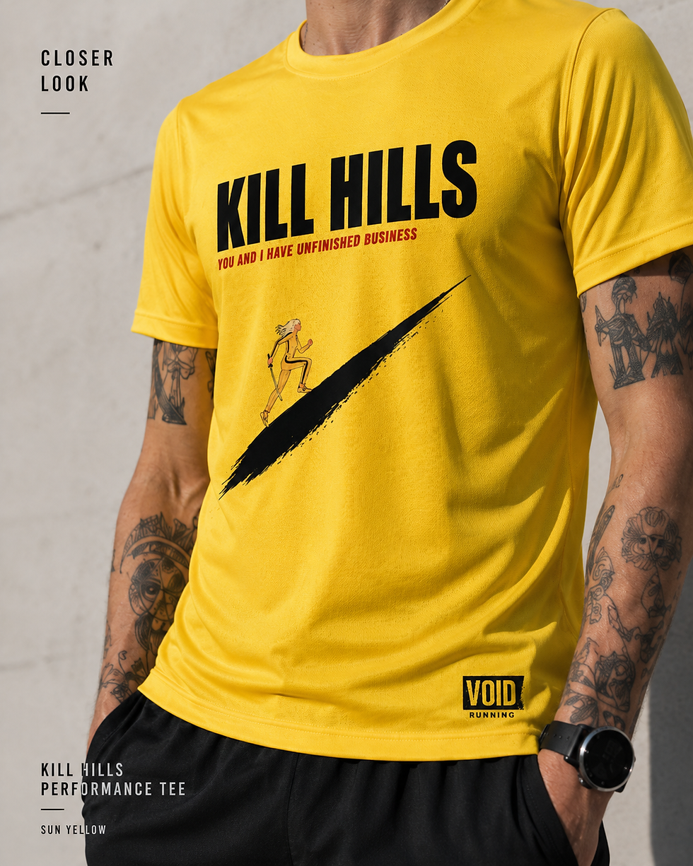 Thumbnail: Male model wearing the sun yellow KILL HILLS performance running tee with black running shorts.