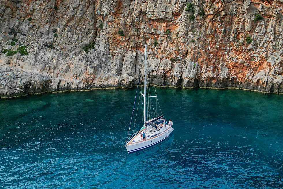 photo of a sailboat on the cretan sea