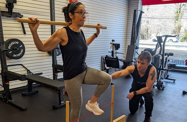 Strength and Conditioning Specialist Assessing client Hurdle Step (FMS-1)