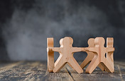 business-success-teamwork-concept-with-wooden-figures-people-side-view.jpg