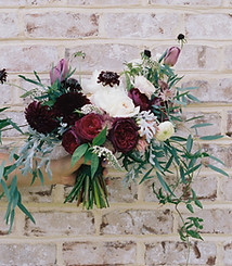 Flowers Against Brick Wall