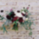 Flowers Against Brick Wall