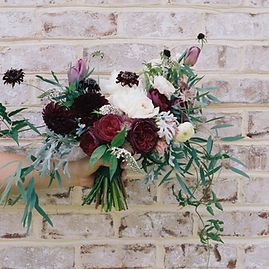Flowers Against Brick Wall