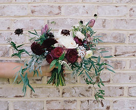 Flowers Against Brick Wall