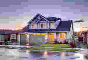house with solar panels at dusk