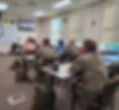 classroom of men and women in army uniform
