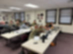 adult learners working on a project at their desk