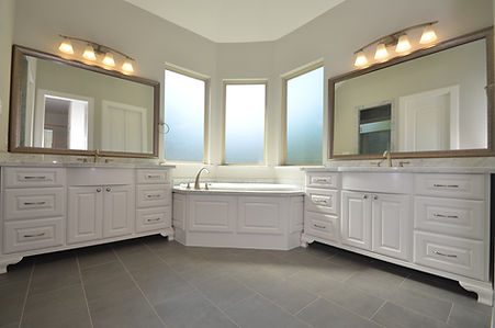 custom kitchen subway tile upgraded granite island with turned legs chicken wire pendants wood tile floors