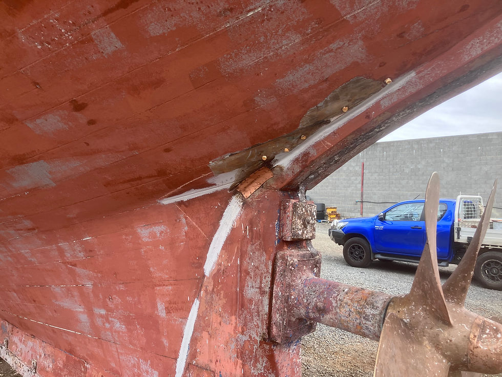 Refastening of planking and recaulking of stern post