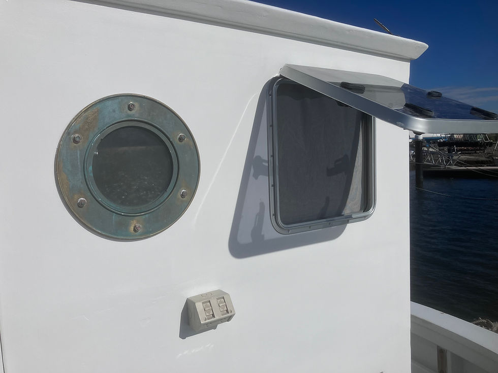 Whole back panel of wheelhouse has been replaced and old porthole and new hatch installed with mosquito netting to stave off those pesky west coast mossies