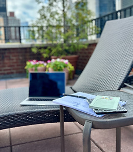 Lounge chair on NYC roof with computer