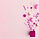 Collection of pink birthday party objects in a gift box