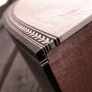 Purfling work for acoustic guitar. Fishbone binding used in this guitar