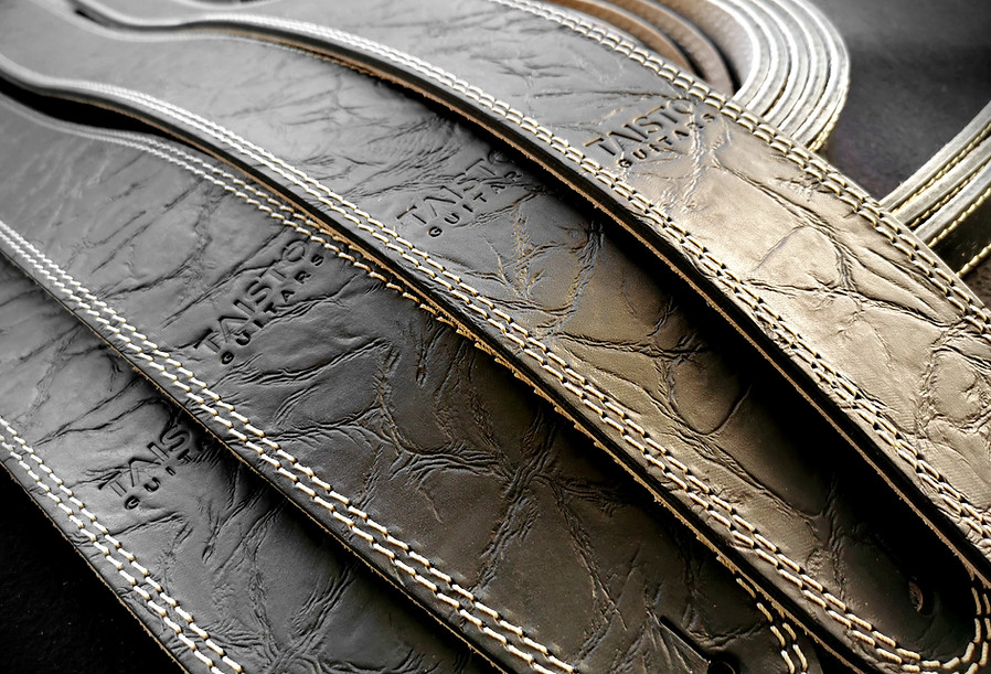 Link to our accessory page - in picture there is a set of TAISTO Guitars branded black matte leather straps