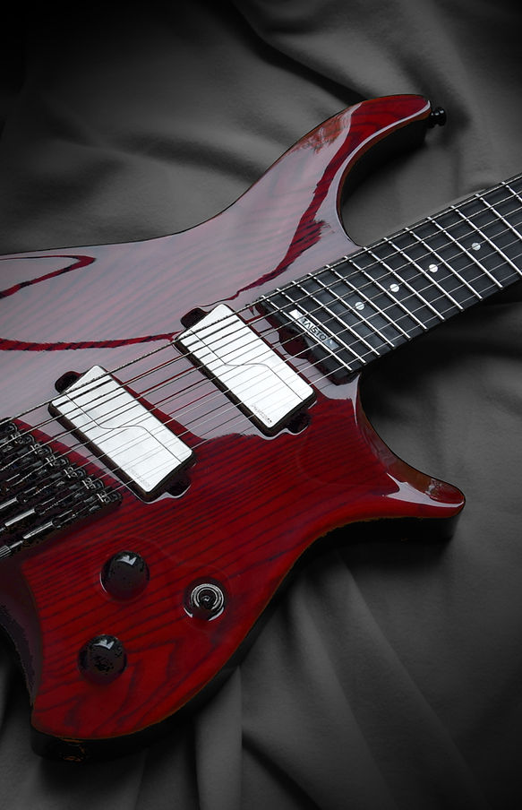 Modern, neck thru' multi-scale headless custom guitar with red high gloss finish. Guitar is loaded with Fishman Modern Fluence active pickups.
This guitar model is available for you to order!