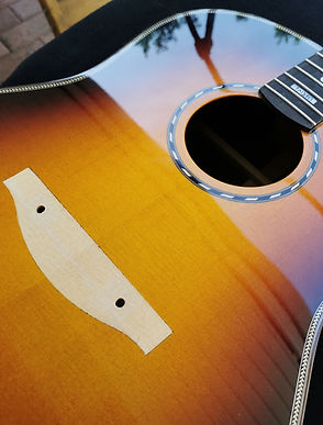 Wooden bridge piece to be glued on top wood.