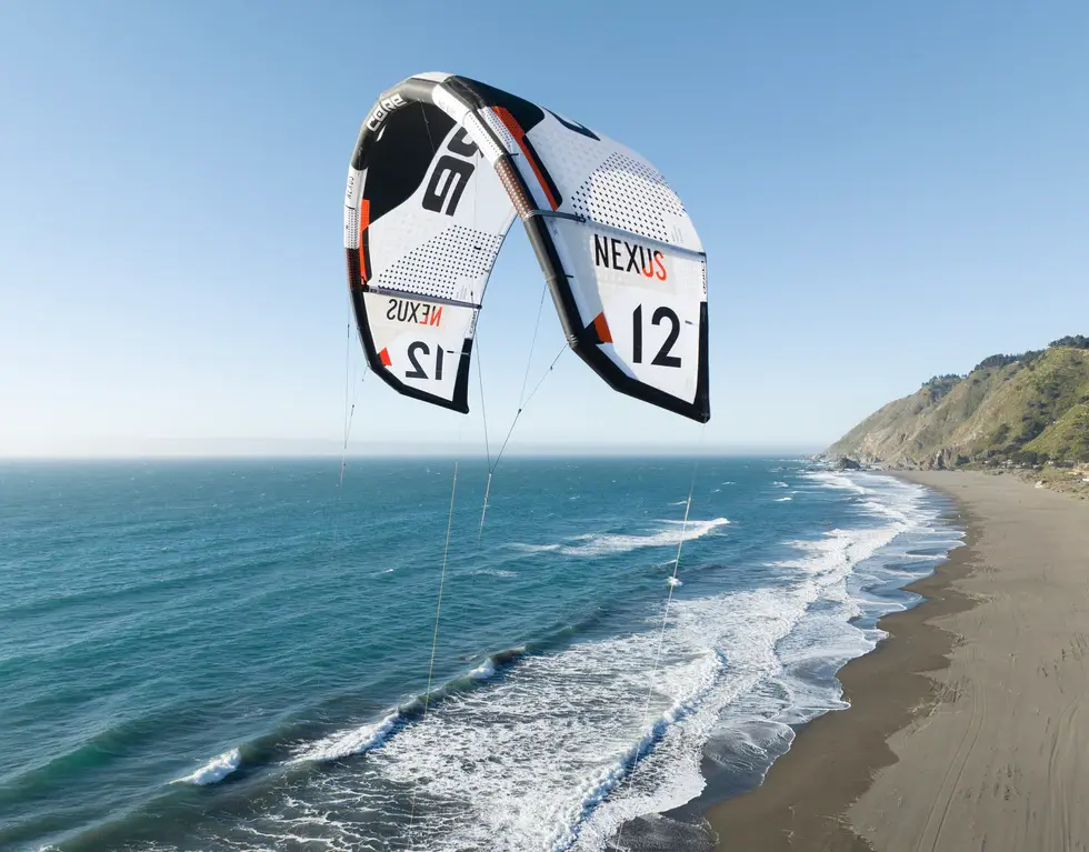 Airborne 12m Nexus kite, kitesurfing over ocean waves