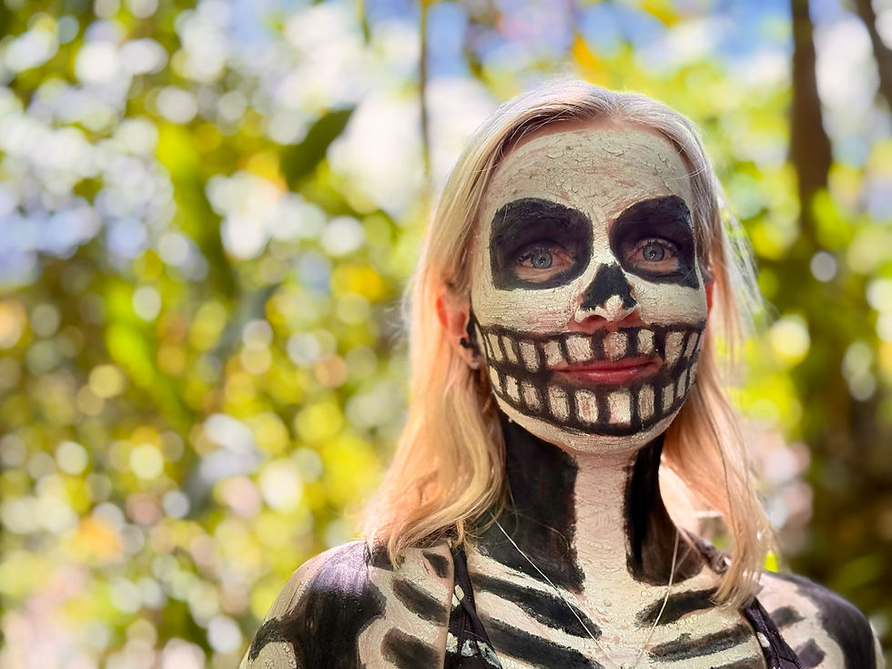 Annina Sandberg with skeleton body painting in Papua New Guinea Highlands during tribal experience