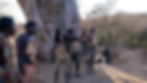 Hadzabe men demonstrating traditional archery during a cultural experience in northern Tanzania