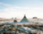 Panorama of a traditional Sami lavvu tent on the autumn tundra in northern Norway, showcasing Indigenous Sami culture and reindeer-herding landscapes.