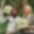 Anniina Sandberg holding an Asaro Mudman mask alongside a local man in the Papua New Guinea Highlands, both playfully sticking out their tongues.