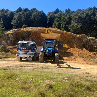 Dempster Diggers Truck, tractor and digger working in a farm quarry