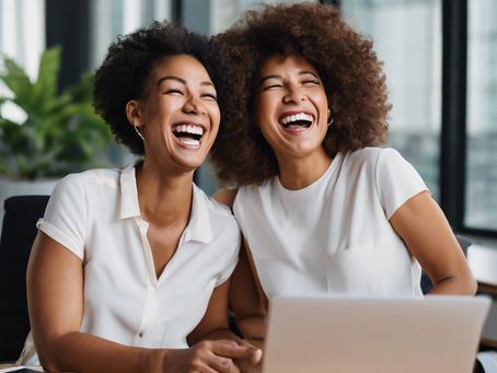 2 coworkers laughing together