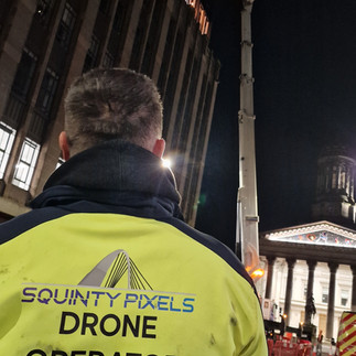 Squinty Pixels - Jamie BTS drone filming a commercial glazing and industrial lift in Glasgow City centre
