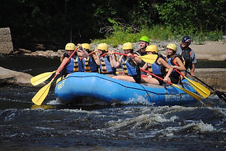 Camp counsellors white water rafting