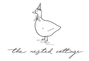 the nested cottage duck and text logo