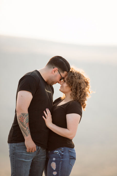 Cute couple in matching outfits at a golden hour photoshoot with Summit & Sage Photography in Kuna, Idaho.