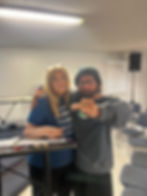 Audrey Fay rewarding student with chips of achievement