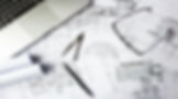 Laptop, blueprints, compass, and glasses: architectural design process and shop drawings