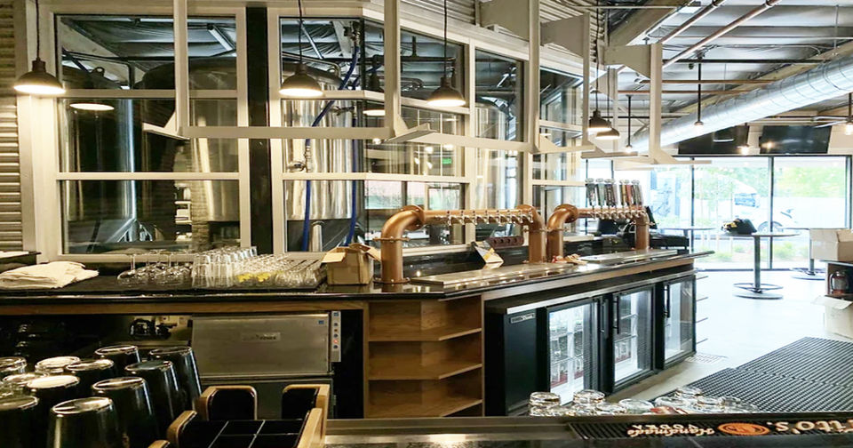 Executive Interiors. Photo of  behind a bar showcasing their MadDuck project. Complete redesign of website to enhance user experience, modernize the interface, and improve performance.